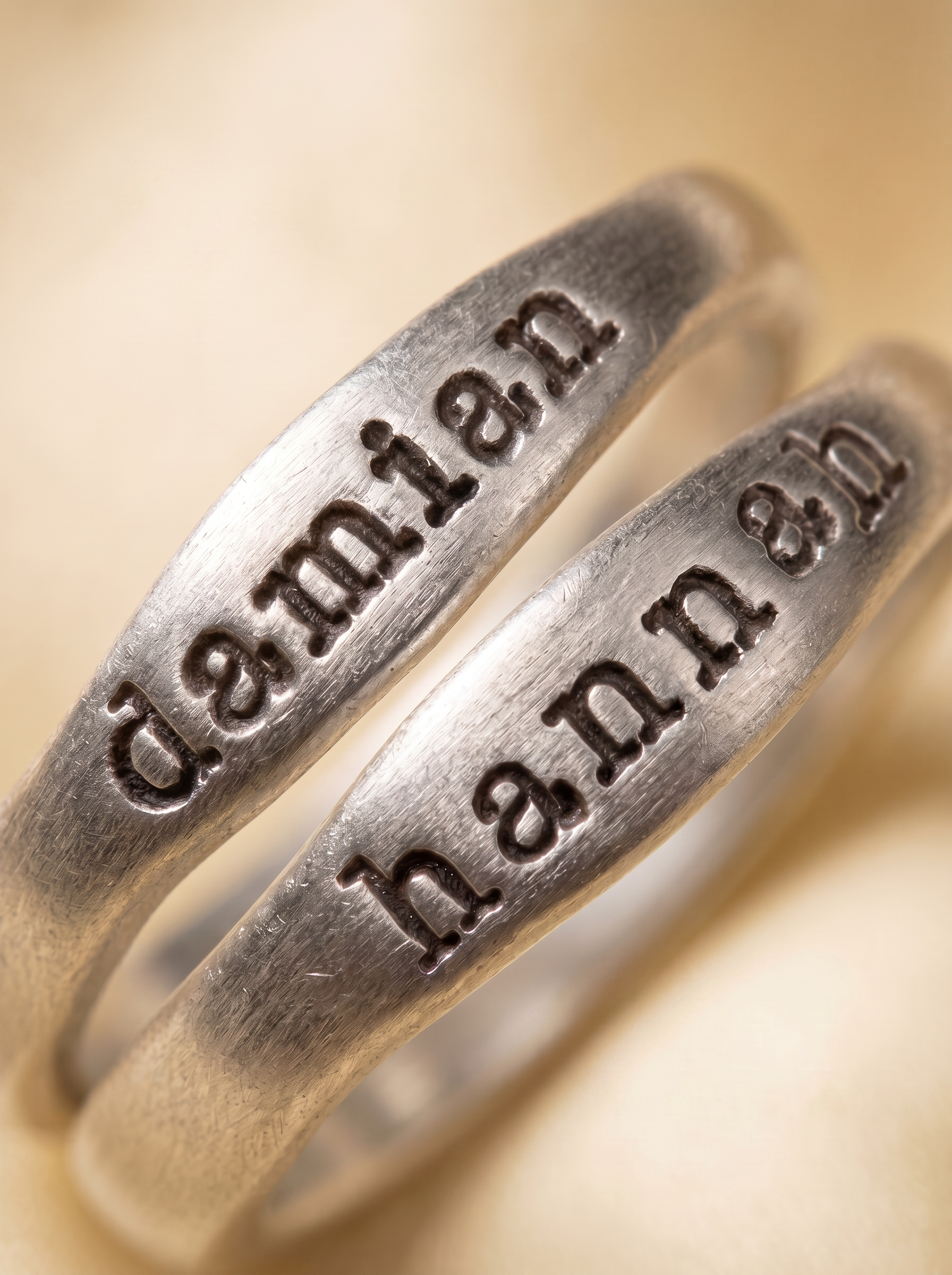 Lisa Leonard Stacking Ring macro detail - hand-stamped names, organic artisan shape