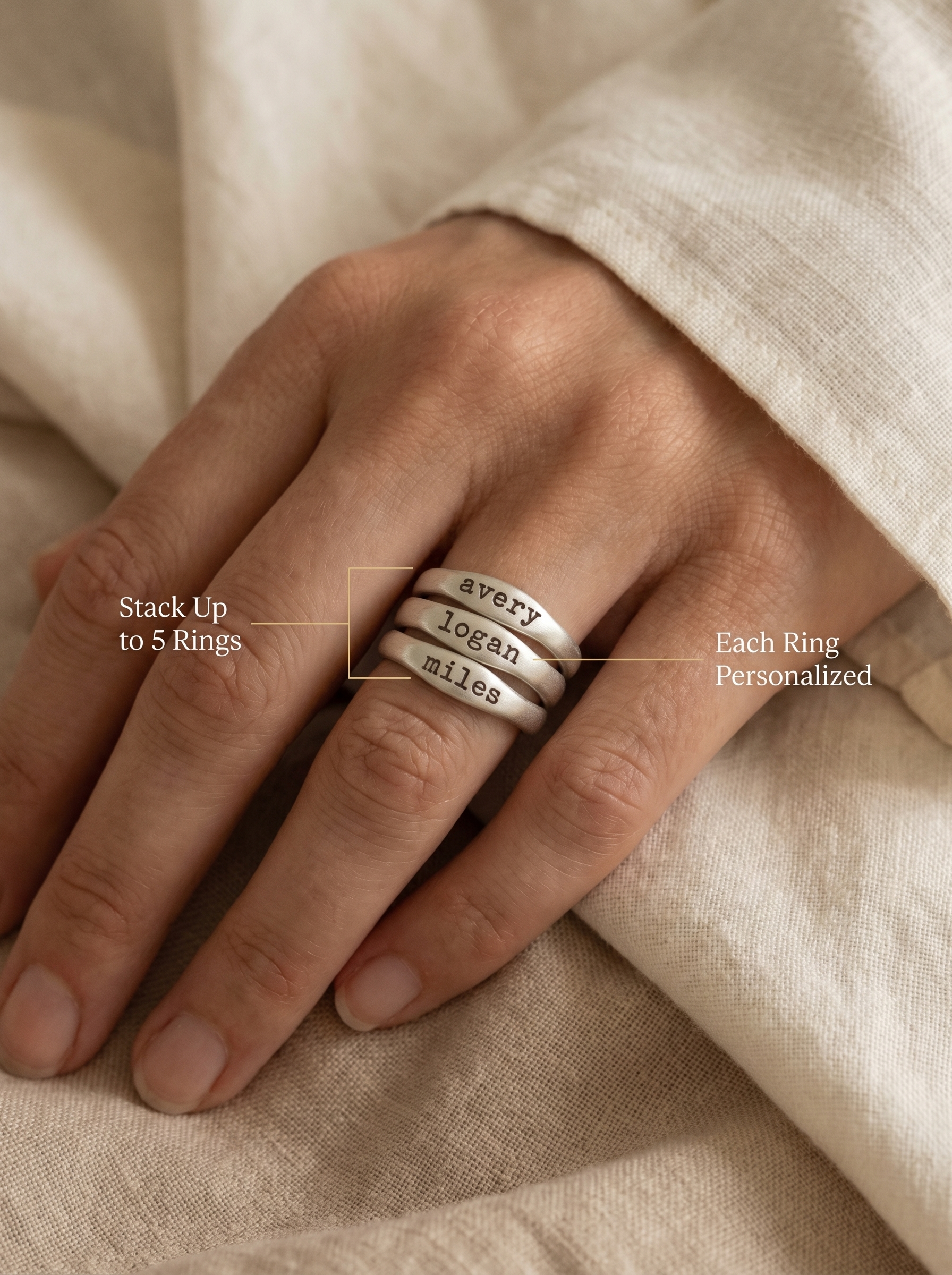 Three Lisa Leonard Stacking Rings on a hand — stack up to 5, each personalized